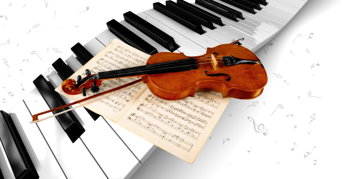 Pianon koskettimet, viulu jousineen ja nuottilehti.