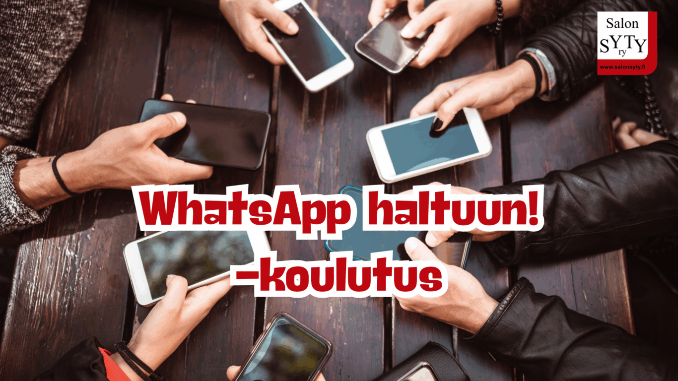 Joukko ihmisiä puhelimet käsissään pöydän ääressä. 