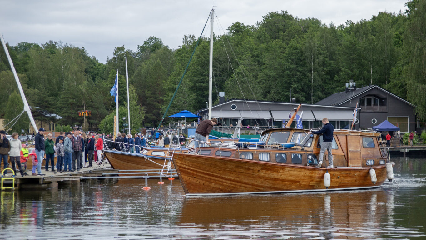 People on a pier at Mathildedal Wooden Boat Fest